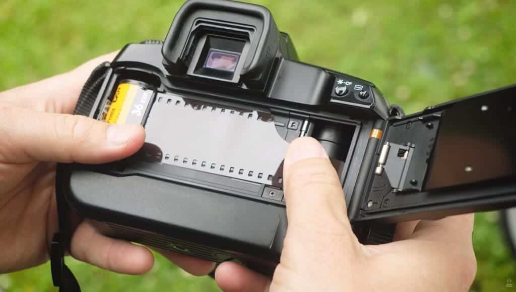 male hands working with the film camera