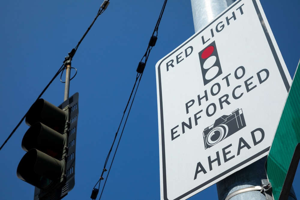 Low Angle View On A Photo Enforced Red Light Camera