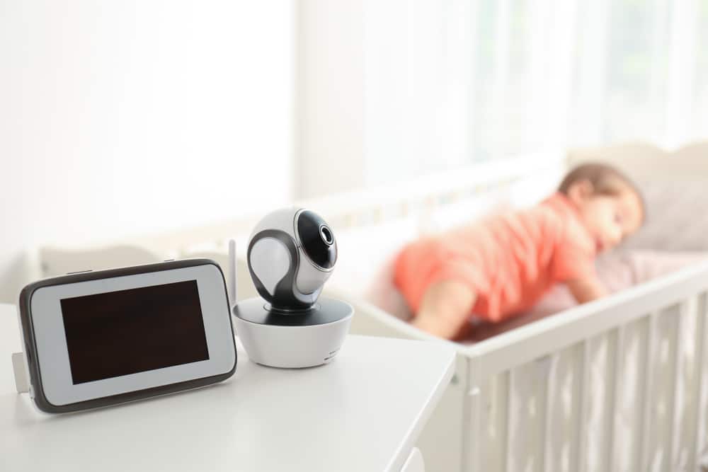 a baby with the baby monitor